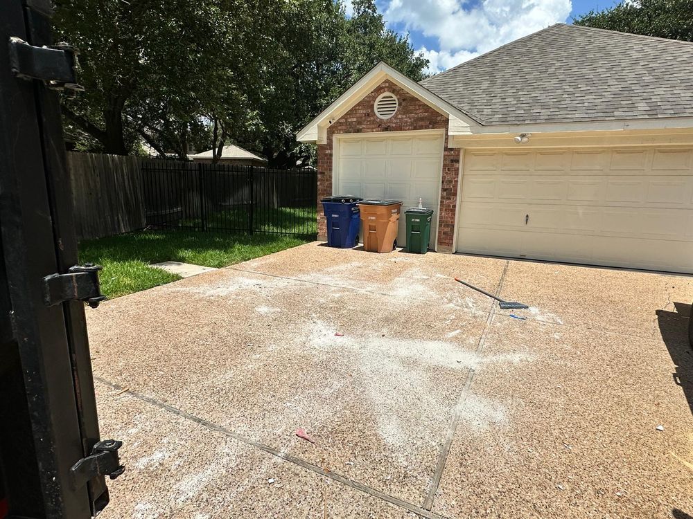 After: driveway completely cleared of carpet and debris